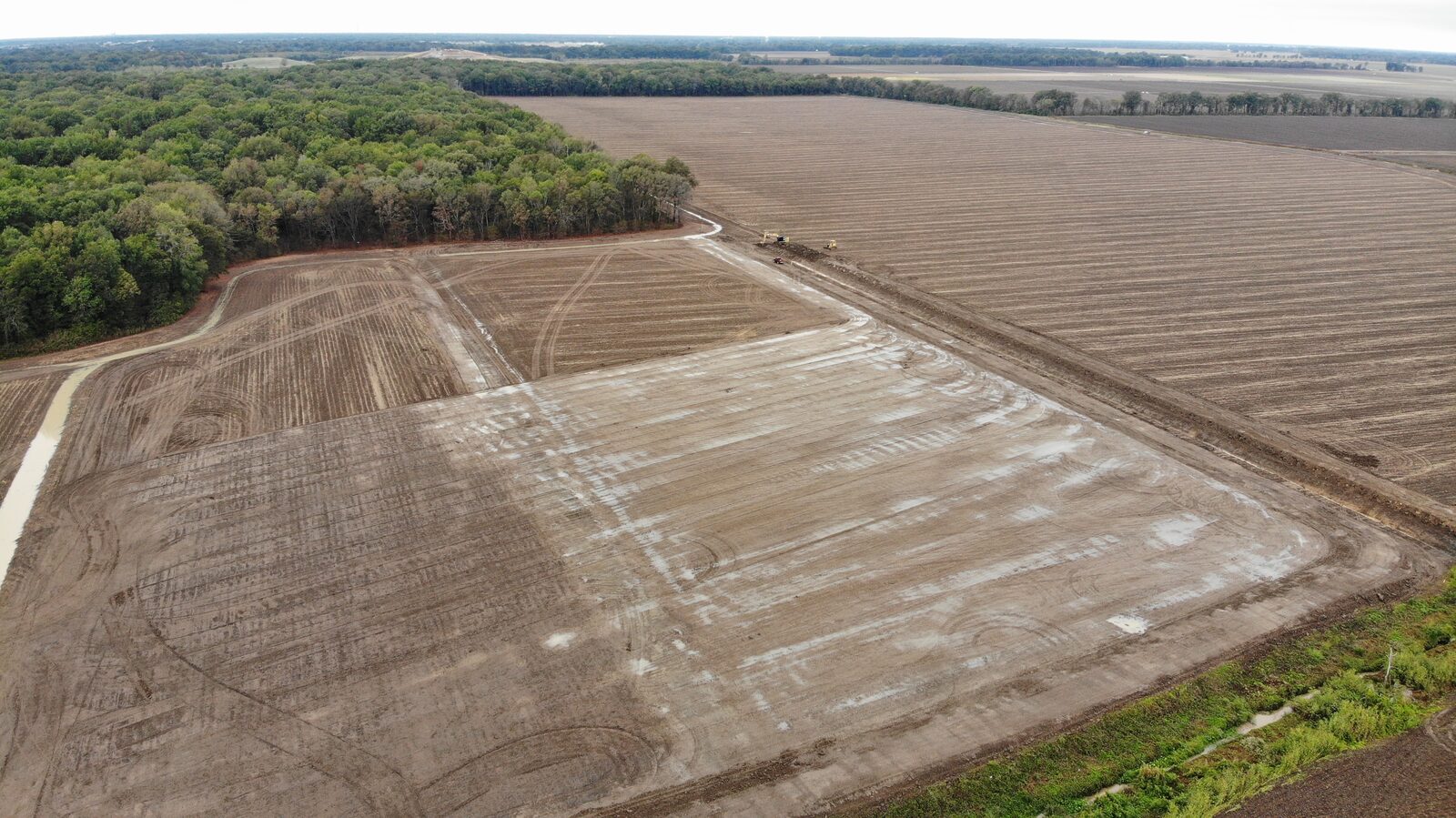 Graded field with adjacent farmland