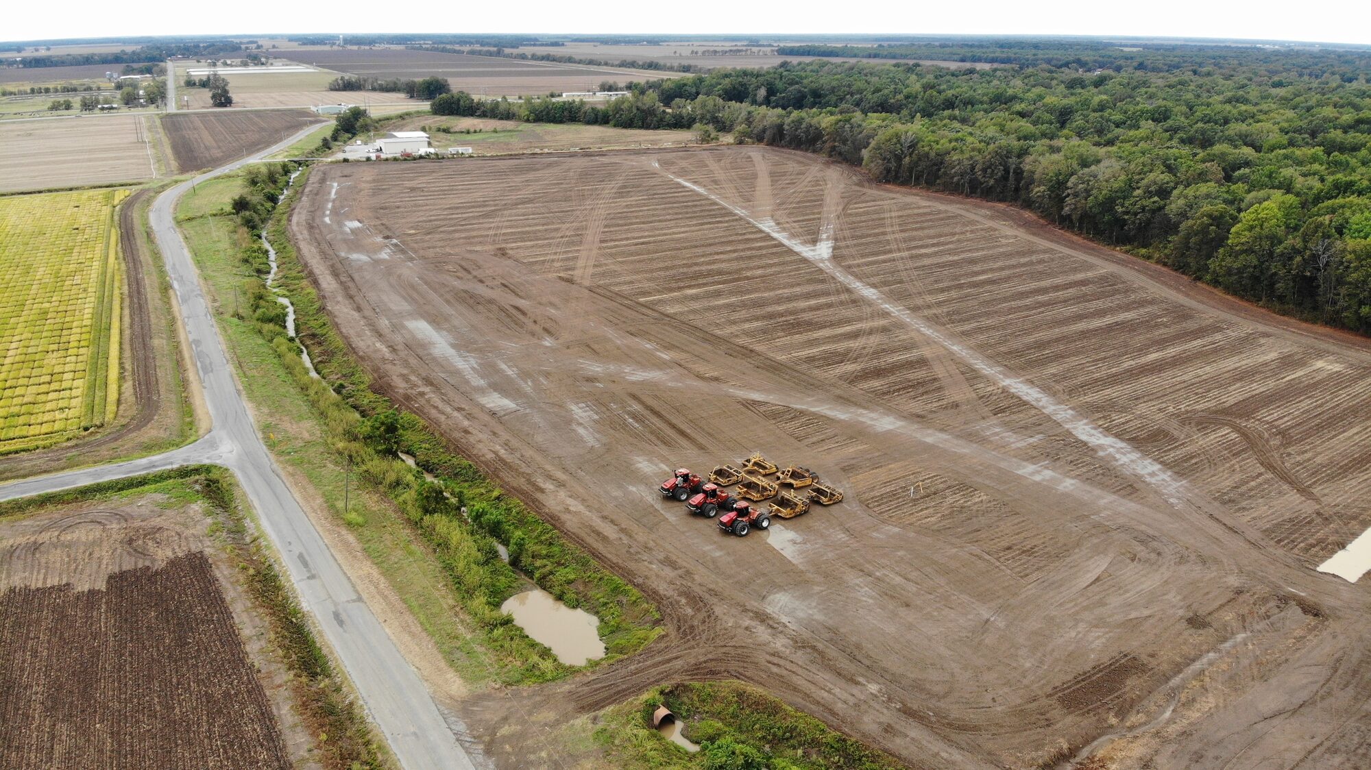 Aerial view of a freshly graded field with Hughes Dirt Work equipment